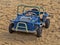 Cute sand jeep on the beach