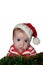 Cute Santa baby with dumbfounded face dressed in red sanata hat