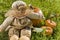 Cute scarecrow doll with pumpkins
