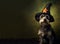 Cute schnauzer wearing a black witch hat for Halloween on a dark green background with space for text. Generative AI