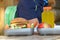 Cute schoolboy eating outdoors the school from plastick lunch boxe. Healthy school breakfast for child. Food for lunch