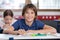 Cute Schoolboy Smiling In Classroom