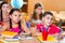 Cute schoolchildren in classroom at school