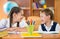 Cute schoolchildren having fun in classroom