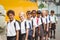 Cute schoolchildren waiting to get on school bus