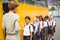 Cute schoolchildren waiting to get on school bus