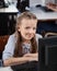 Cute Schoolgirl With Computer At Desk