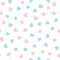 Cute seamless pattern with blue and pink hearts scattered on white background.