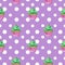 Cute seamless pattern with a mint cupcake and polka dots on violet background