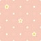 Cute seamless pink flat background with polka dot pattern and white flowers.