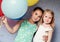 Cute sisters with colorful balloons