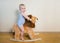 Cute small baby boy riding on the lion toy . Happy child emotions.