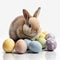 Cute small bunny with colorful easter eggs