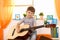 Cute small kid with guitar