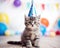 cute small kitten wearing a party hat.