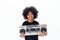 Cute and smiling African American kid holding a musical jukebox