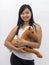 Cute smiling asian girl with a teddy horse