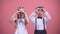 Cute smiling children making hearts with their hands, celebrating Valentines day