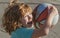 Cute smiling excited boy plays basketball. Funny child face closeup.