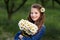 Cute smiling girl with a bouquet of daisies and a flower in the hair. girl with a bunch of chamomiles