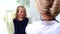 Cute smiling kid girl with blond hair at pediatrician appointment