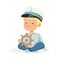 Cute smiling little boy character wearing a sailors costume sitting on the floor playing toy wooden ship wheel colorful