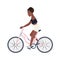 Cute smiling teenage girl dressed in shorts and top riding bicycle. Young woman or female cyclist pedaling pink bike