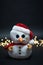 Cute snowman toy standing in front of blurred golden bokeh