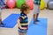 Cute sporty kid exercising on yoga mats in gym, children sport school concept