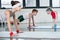 Cute sporty kids exercising on yoga mats in gym and smiling