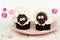 Cute spring sheep cupcakes on pink plate with Easter eggs