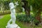 The cute statue in green garden.Thailand