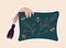 Cute sticker of hand holding a pillow sewed with flowers on cloth