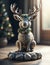 Cute stone figurine of a Christmas reindeer wearing a Christmas wreath