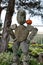 Cute stone sculpture with small pumpkin balanced on shoulder, seen at popular nursery Connecticut, 2018