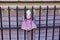 A cute straw fabric blonde girl doll wearing pink vintage folk dress is attached on the window guards