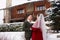 Cute stylish couple on wedding day. Bride and groom meet for the first time. First look. Winter wedding on snowfall with