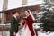 Cute stylish couple on wedding day. Bride and groom meet for the first time. First look. Winter wedding on snowfall with