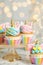 Cute sweet unicorn cupcakes on white marble table against blurred lights