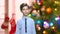 Cute talking boy on abstract Christmas background.