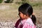 Cute Tarahumara girl wearing traditional bright outfit in Copper