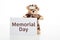 Cute teddy bear in soldier uniform and a memorial day text card isolated against white background