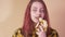 Cute teen girl eating banana