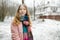 Cute teen girl having fun on a walk in city park on chilly winter day. Teenage child exploring nature