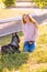 Cute teen girl with red long hair walks with her husky breed dog in the autumn park. Children and dogs.