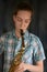 Cute teenage girl practicing saxophone