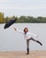 Cute teenage girl with umbrella enjoy cloudy day