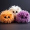 cute three multicolored plush balls - pompoms with long fur made of synthetic leather