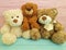 Cute three teddy bear toy child on colored wooden, family