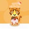 Cute Tiger holds a birthday cake. Happy Birthday Greeting Card